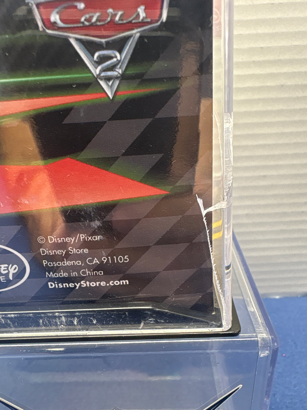 Disney Pixar Cars 2  Disney Store Diecast 1:43 Darrel Cartrip (cracked back)