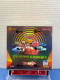 A Disney Cars Hot Box collectible card pack box displayed on a clear stand against a white ribbed wall background. The packaging features Lightning McQueen and other Disney Cars characters with Chinese text.