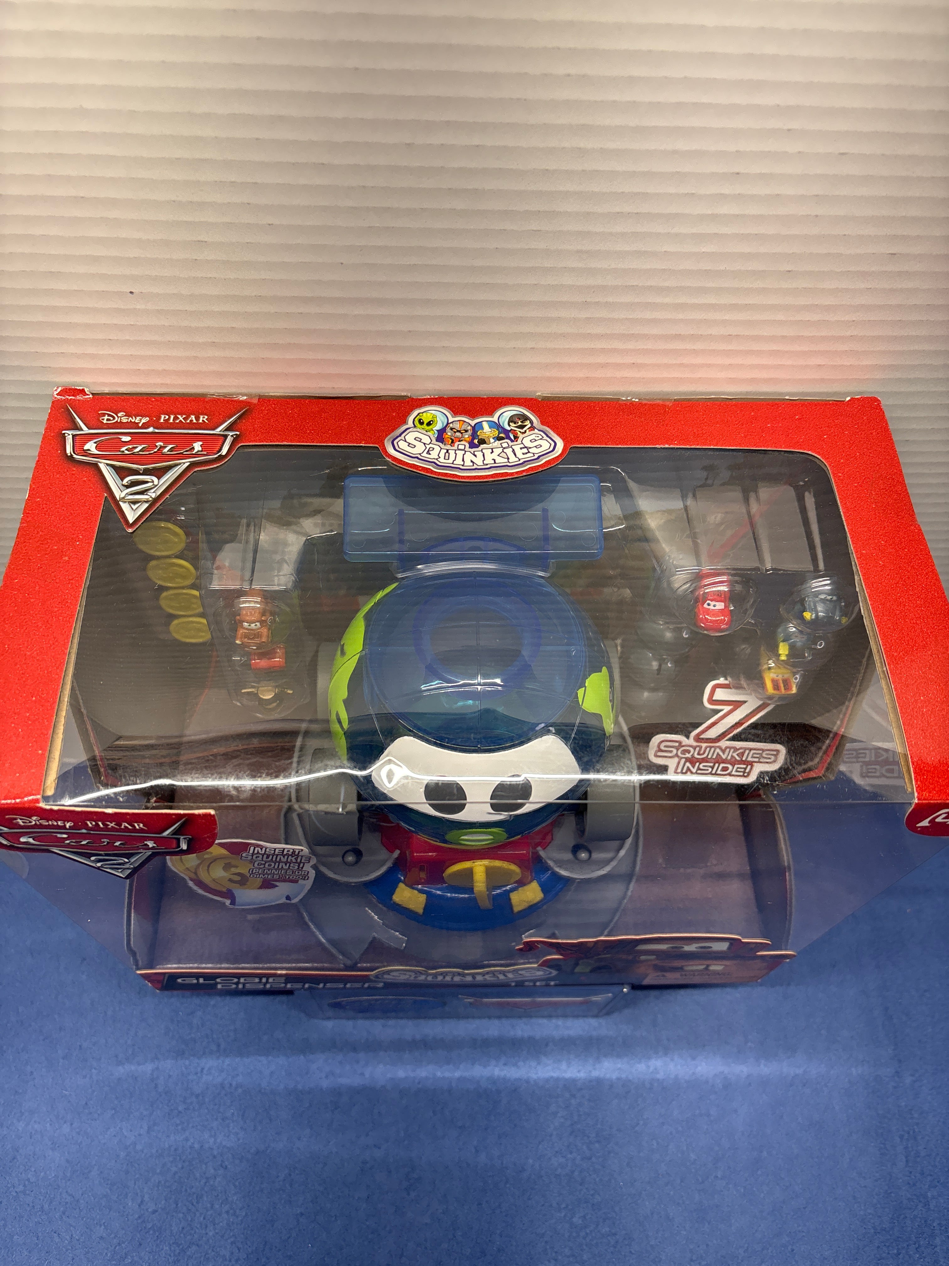 Disney Pixar Cars 2 Globie Dispenser Sealed with squinkies and coins