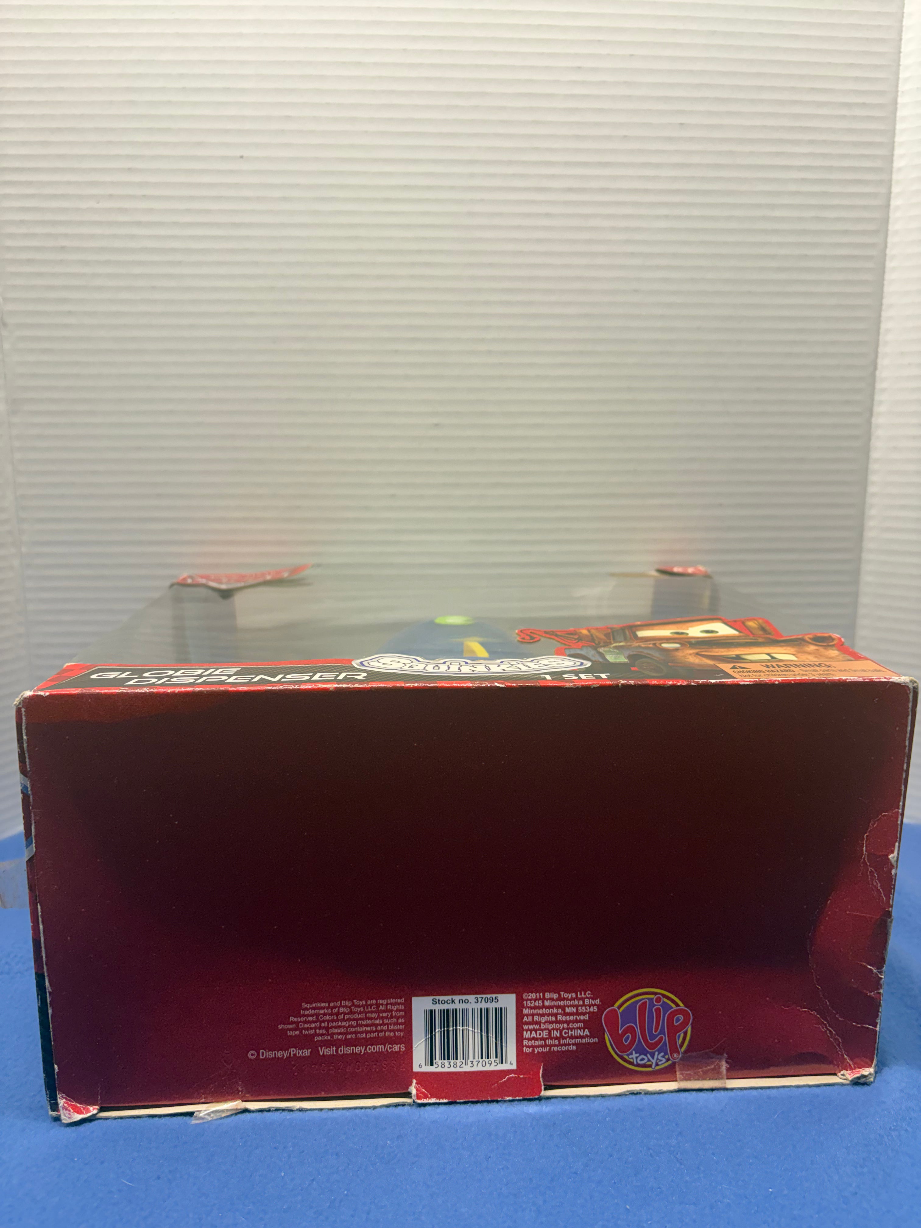 Disney Pixar Cars 2 Globie Dispenser Sealed with squinkies and coins