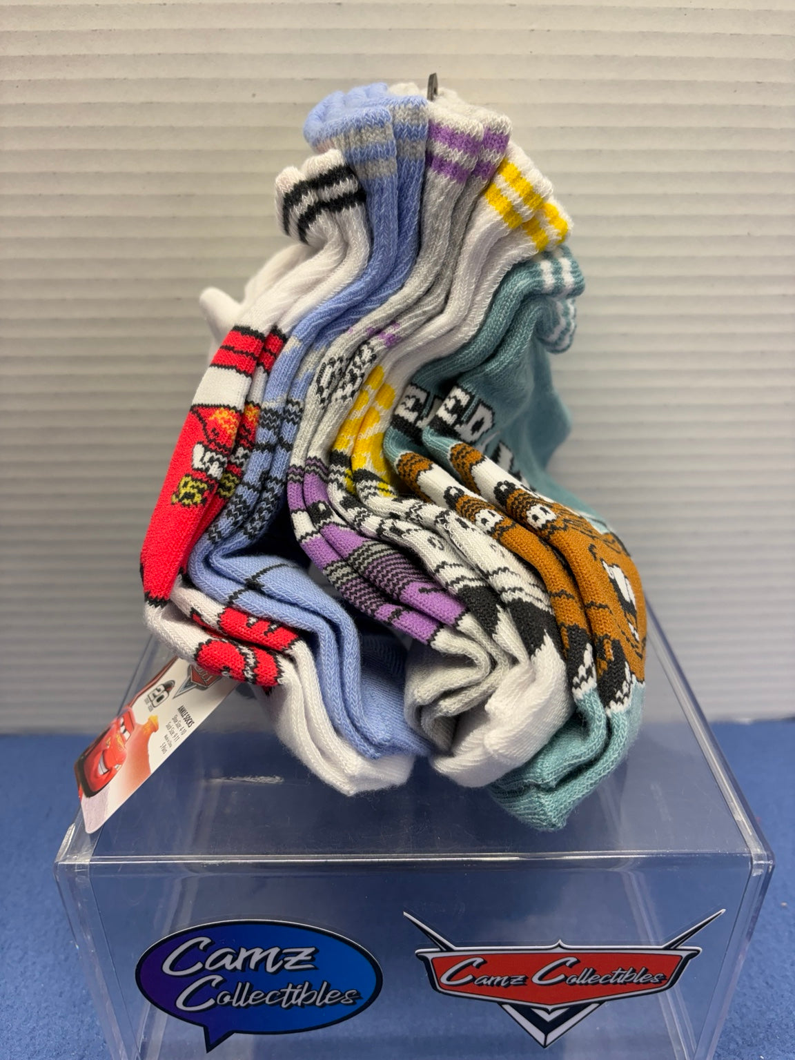 Side view of five assorted pairs of Disney Pixar Cars ankle socks