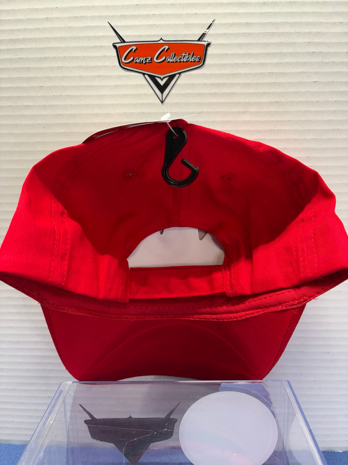 Rear view of red Lightning McQueen kids hat with adjustable strap