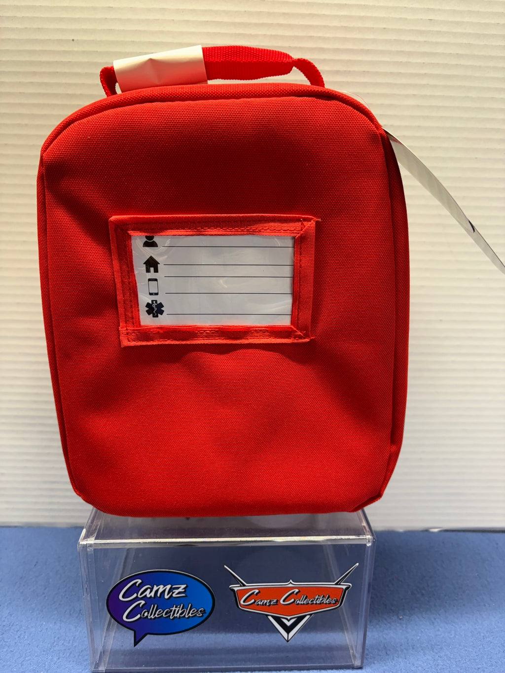 Back of Lightning McQueen lunch box with identification window and top carry handle