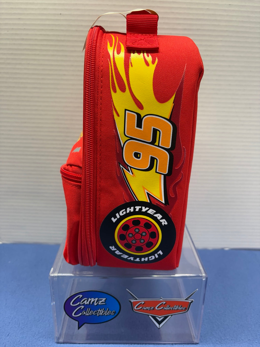 Side of Lightning McQueen lunch box with number 95 lightning bolt and Lightyear tire artwork