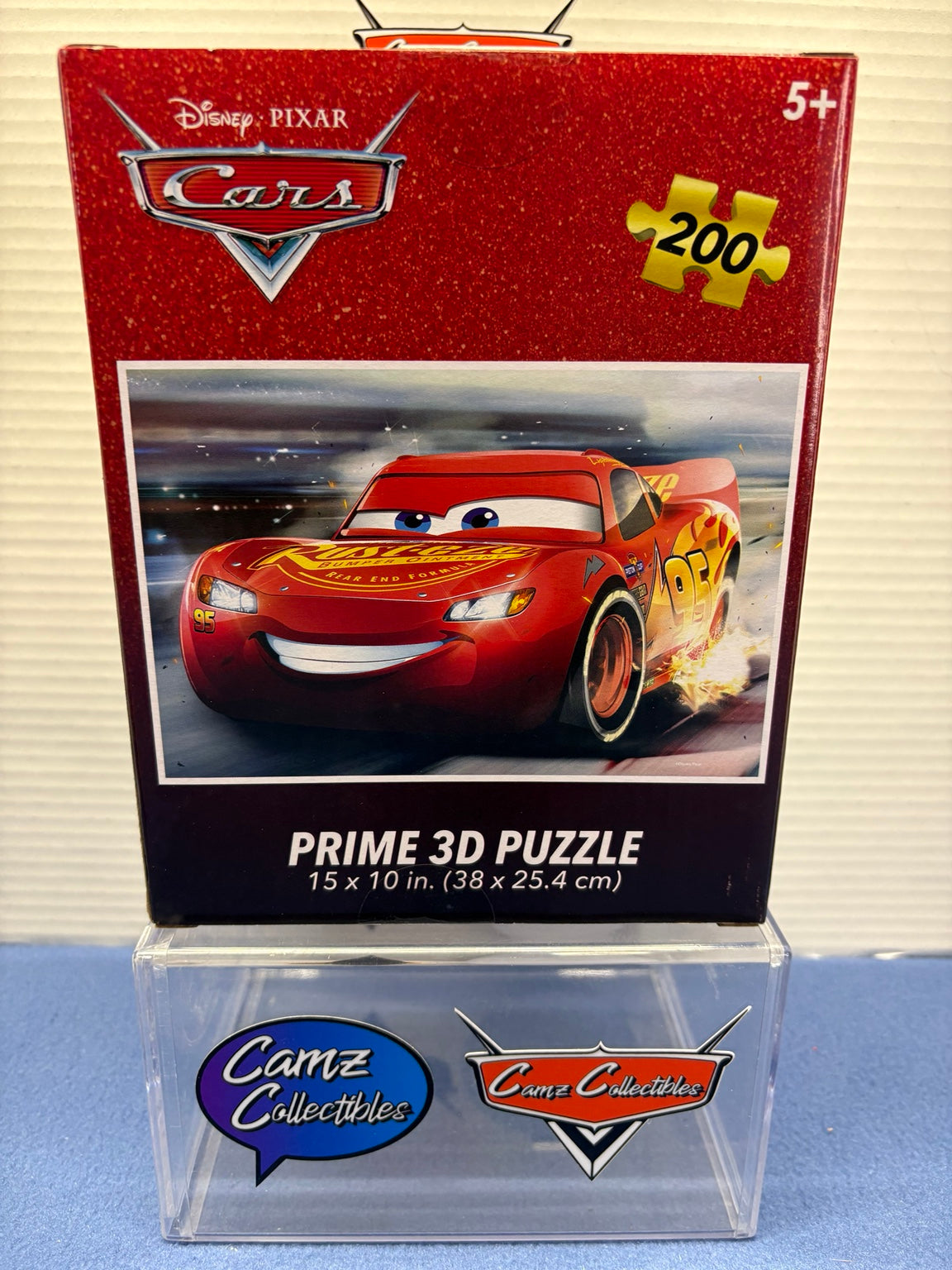 Disney Pixar Cars Lightning McQueen Prime 3D puzzle packaging showing 200 pieces and 15 by 10 inch size