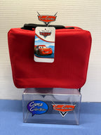 Red back of Lightning McQueen lunch box with black carry handle and Cars hangtag