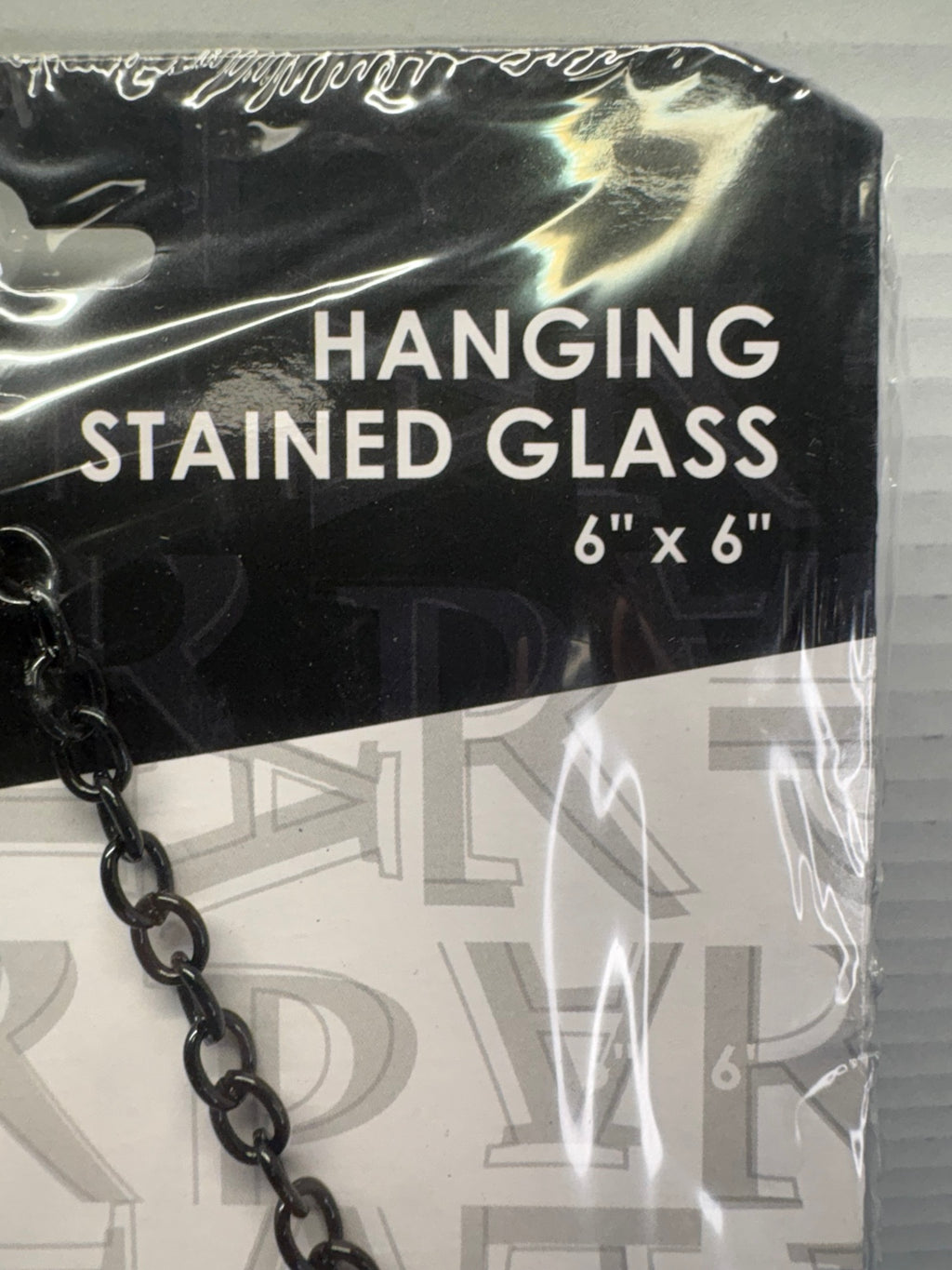 Packaging detail identifying the Cars hanging stained glass as 6 by 6 inches