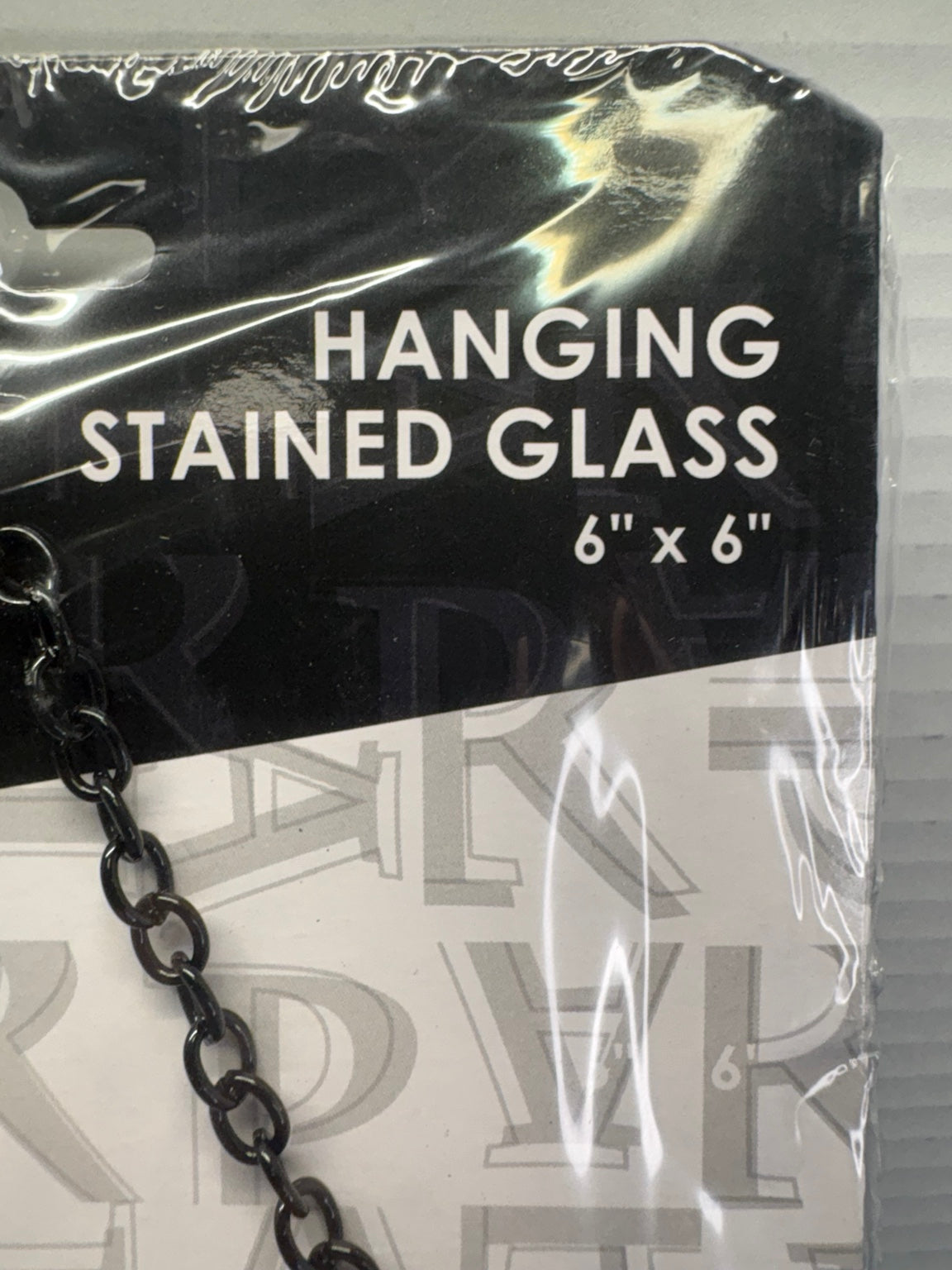 Packaging detail identifying the Cars hanging stained glass as 6 by 6 inches