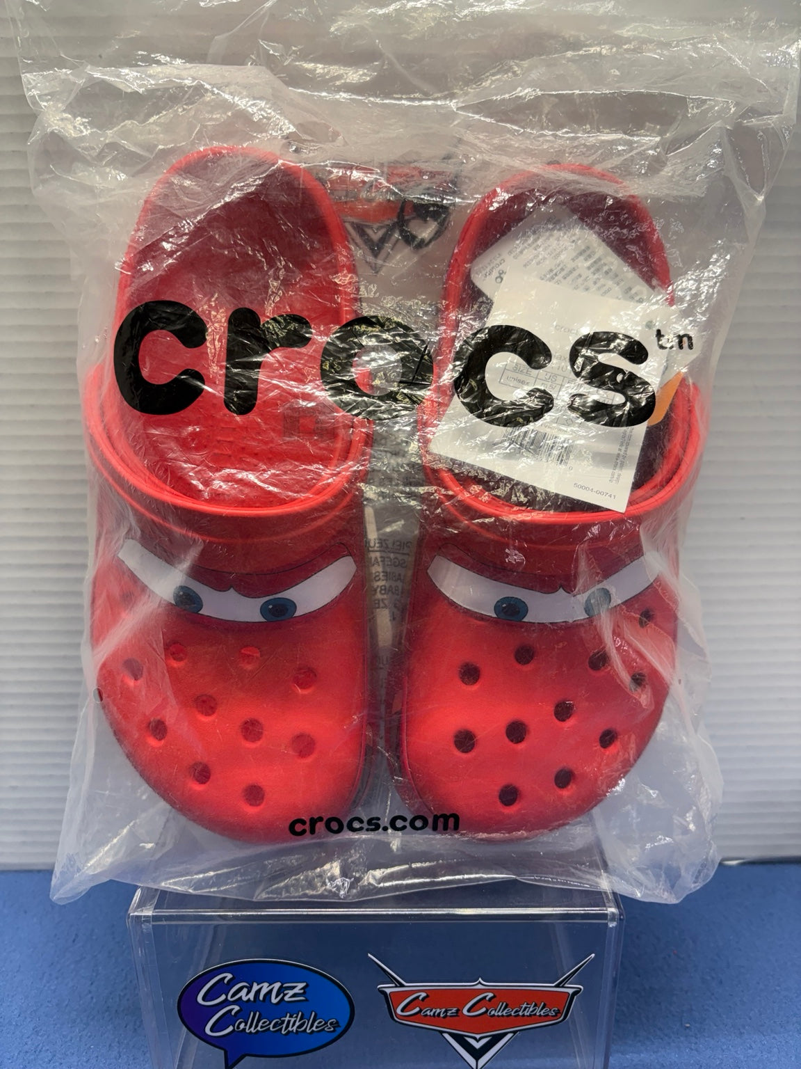 Lightning McQueen Crocs pair in Crocs bag with attached tags