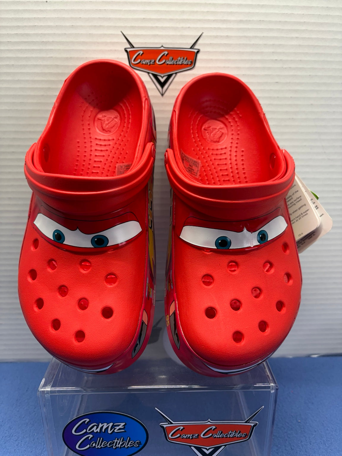 Front view of red Lightning McQueen Crocs clogs, men's 5 women's 7