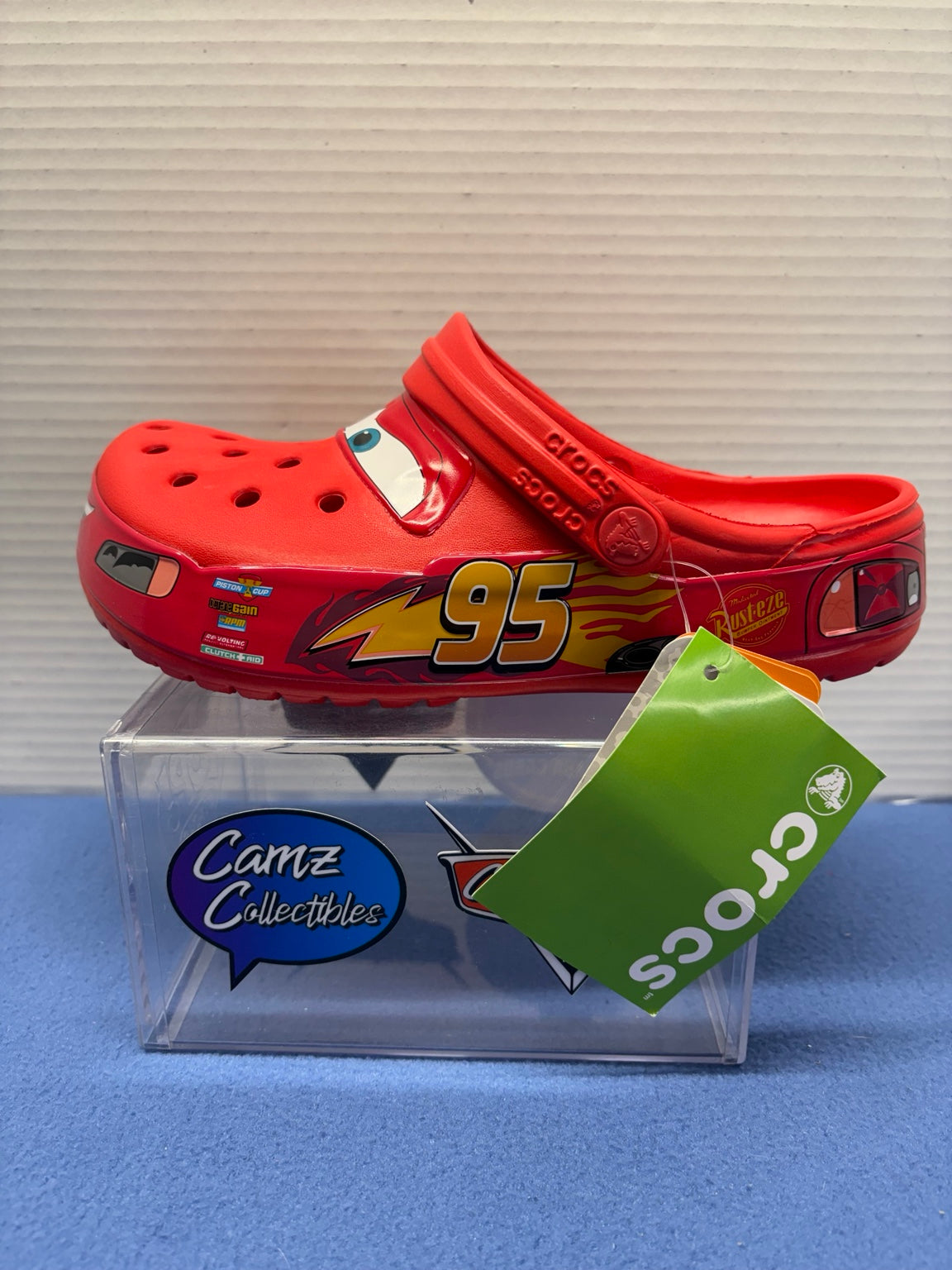 Opposite side of red Lightning McQueen Crocs with attached Crocs hangtag