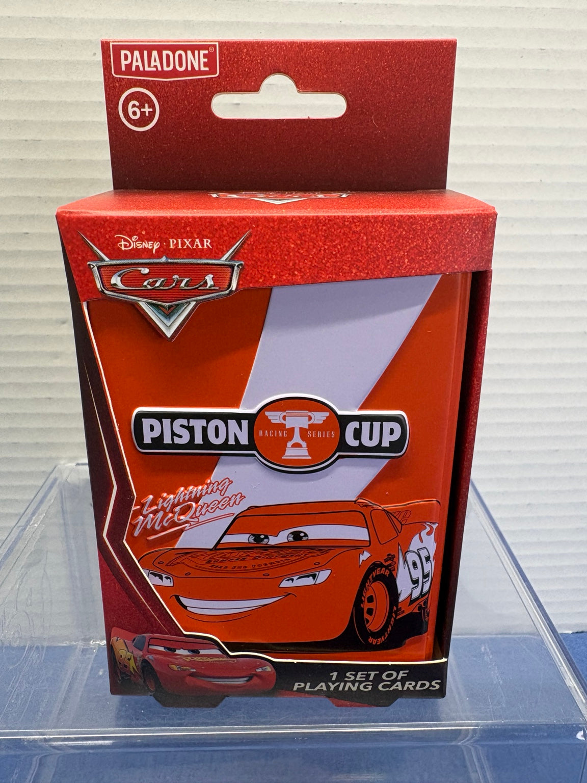 Paladone Disney Pixar Cars playing cards in red Lightning McQueen Piston Cup tin, front packaging