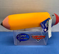 Yellow squishy pencil toy with pink eraser, gray band and pointed tip, shown with attached ages 3+ tag